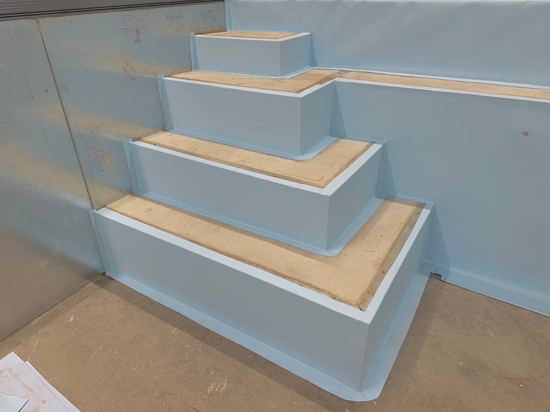 Corner steps cut and shaped in light blue membrane