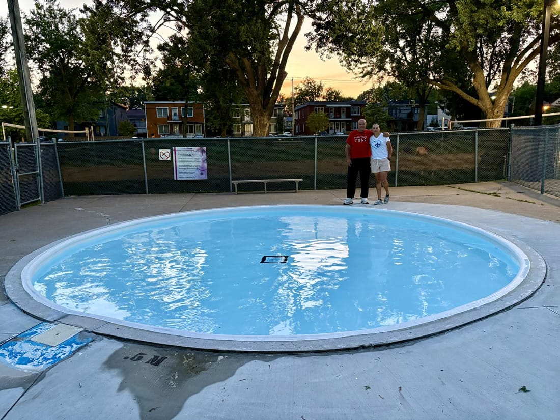 A round public pool re-lined in light blue PVC membrane