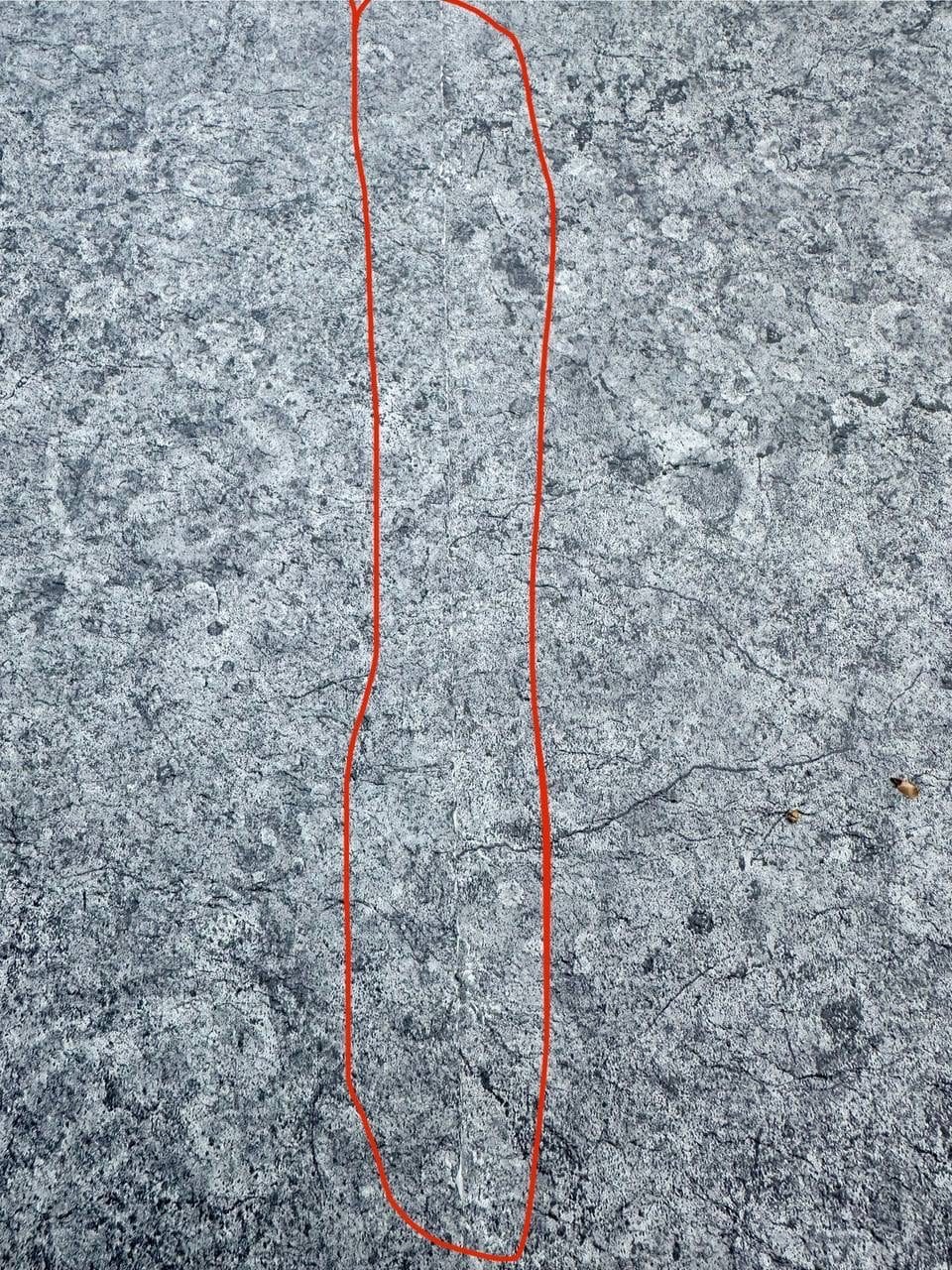 Red lines marked on a stone-pattern membrane before cutting