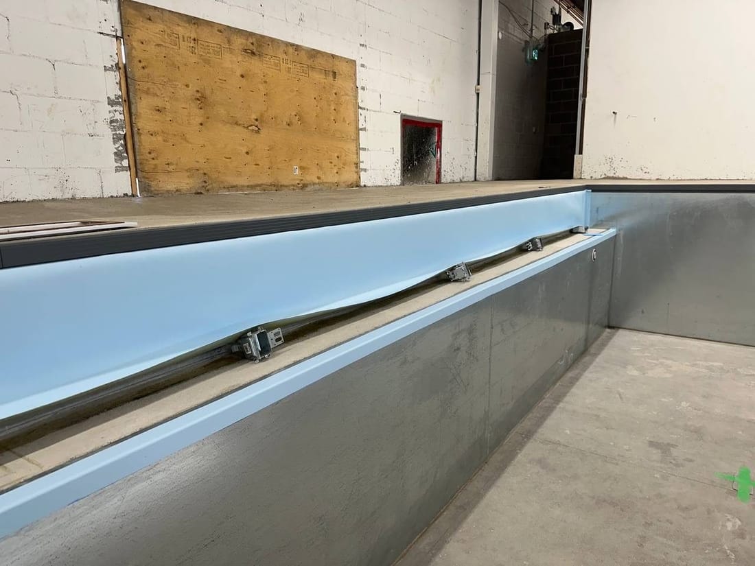 A welded seam along the edge of a pool, seen close