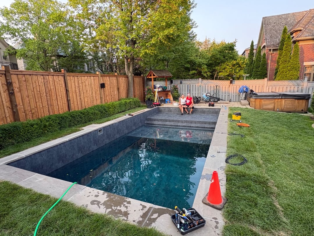 The finished pool, with Damir and Nadia on the steps