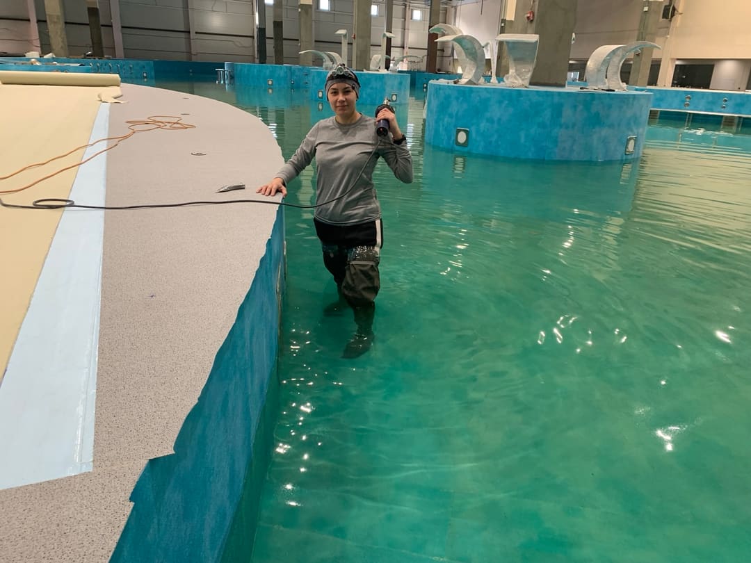 The final PVC membrane weld on the pool deck
